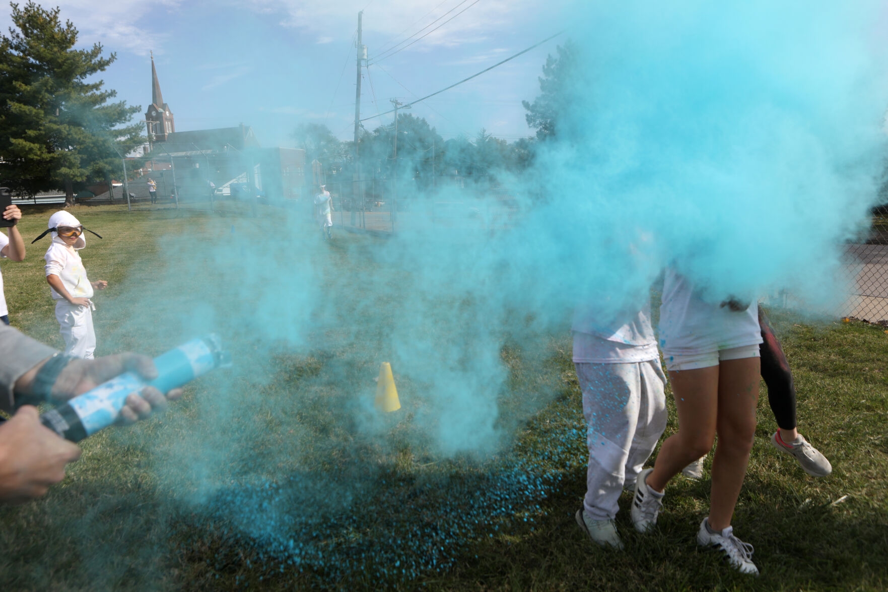 Students are engulfed by blue powder